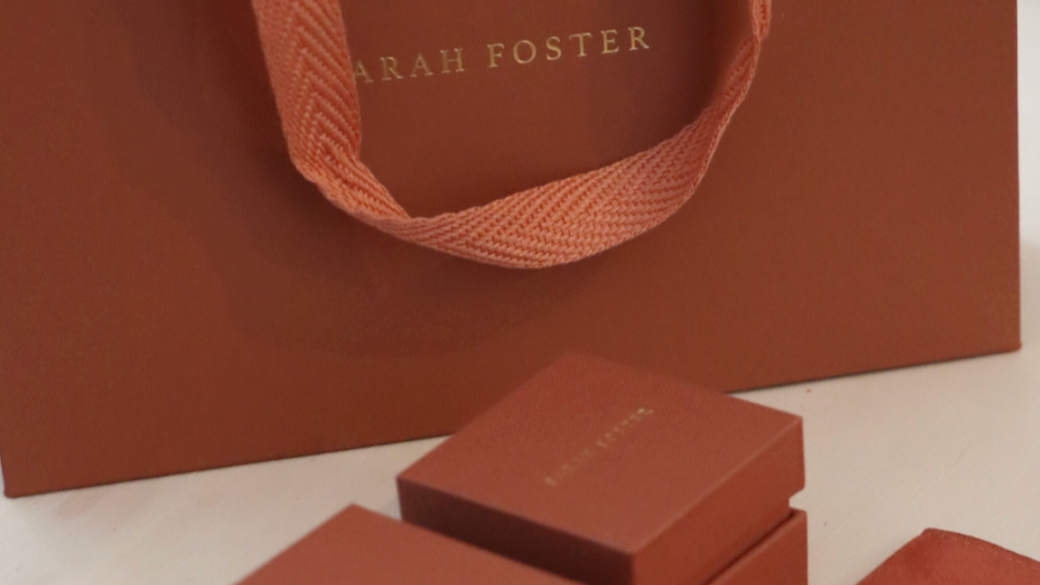 Brown packaging with 'Sarah Foster' branding on a light background