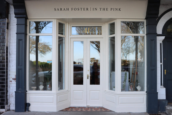 Cream painted shop fron of Sarah Foster | In The Pink Jewellery with large windows and double doors